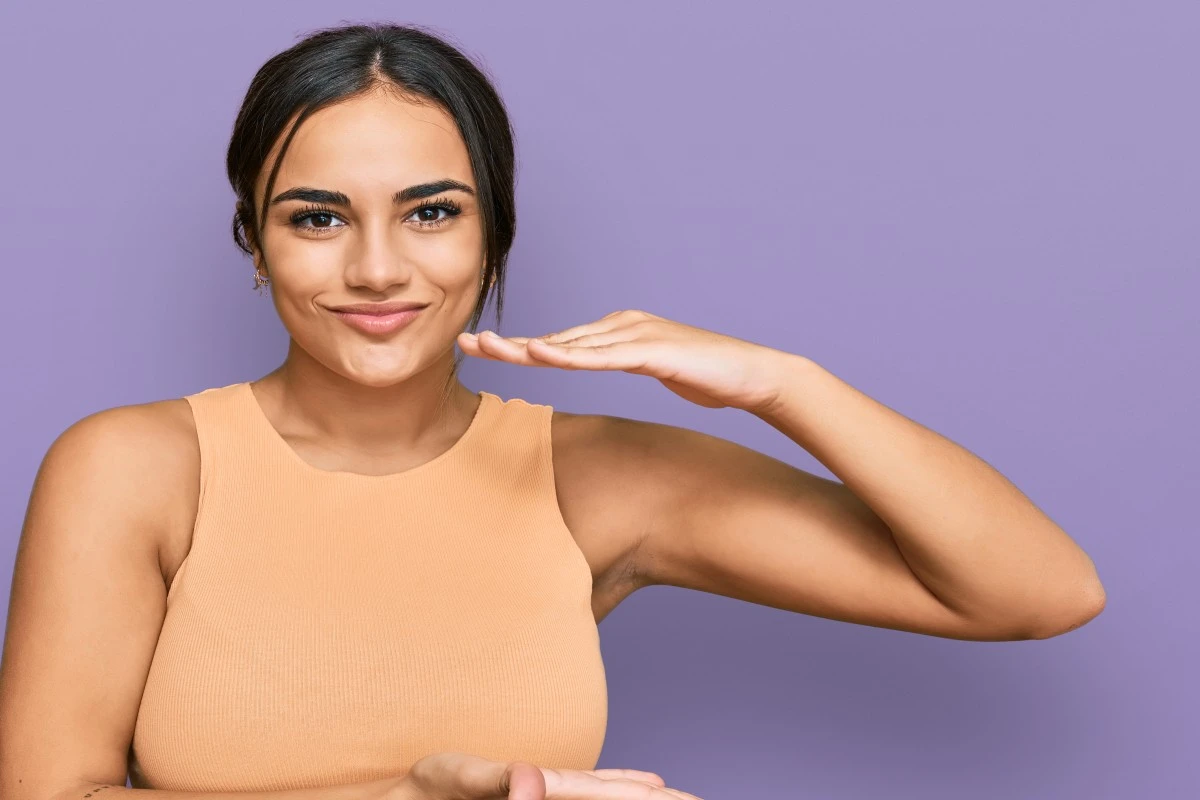 A Girl is very happy because she got pimple-free skin